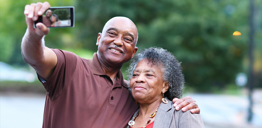 Old couple taking a selfie